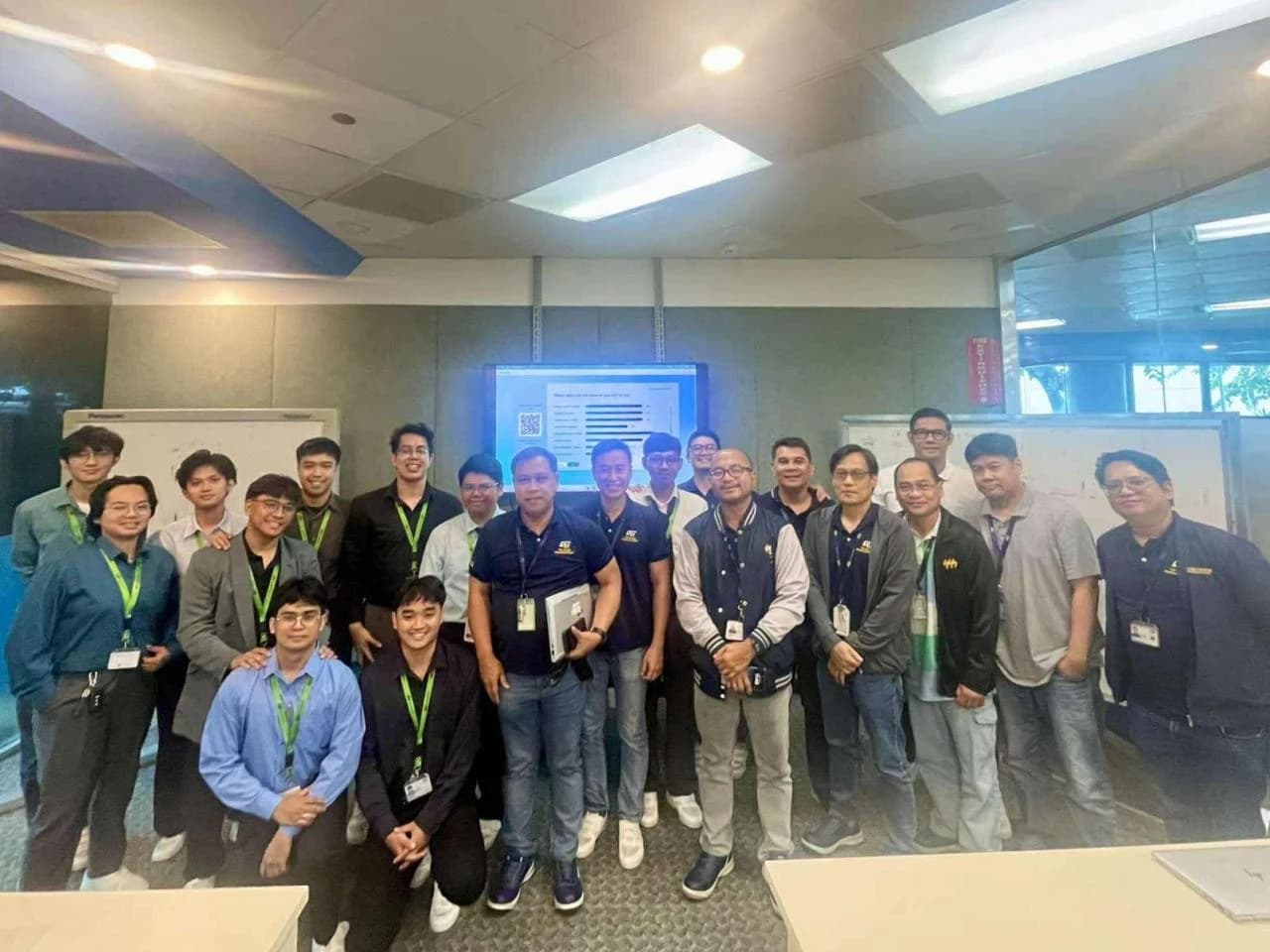 Group photograph in an STMicroelectronics meeting room.